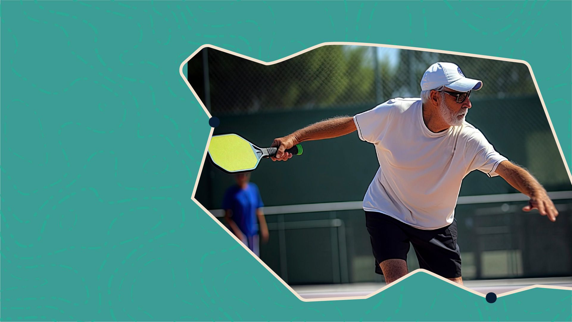 Man playing pickleball, wearing a white shirt and cap, poised to hit a ball with a paddle on a court.